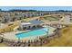 Overhead view of a large community pool, lounge area, playground, and clubhouse at 1024 Channel Drop, Zebulon, NC 27597