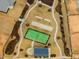 Aerial view of a community park featuring a tennis court and bocce ball at 1024 Channel Drop, Zebulon, NC 27597