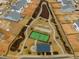 An aerial view of a park area with a tennis court and a bocce ball court at 1024 Channel Drop, Zebulon, NC 27597