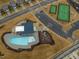An aerial view shows the neighborhood pool, playground, and tennis courts at 1024 Channel Drop, Zebulon, NC 27597