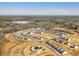 Bird's-eye view of a Primary-planned community with modern homes, a central amenity center, and green spaces at 1024 Channel Drop, Zebulon, NC 27597