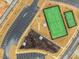 Aerial view showcasing community tennis courts and play areas with ample parking at 1024 Channel Drop, Zebulon, NC 27597
