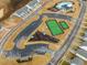 Overhead view of community amenities with parking, tennis courts and a play area at 1024 Channel Drop, Zebulon, NC 27597