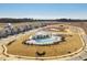 Aerial view showcasing the community pool, clubhouse, and surrounding residences in a new development at 1024 Channel Drop, Zebulon, NC 27597