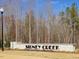 Welcoming entrance sign for Sidney Creek amidst lush greenery and landscaping at 1024 Channel Drop, Zebulon, NC 27597