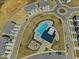 Aerial view of a neighborhood featuring sidewalks, a pool, clubhouse, playground and roundabout at 1033 Channel Drop Lp, Zebulon, NC 27597