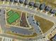 Aerial shot captures the community tennis courts and parking area at 1033 Channel Drop Lp, Zebulon, NC 27597