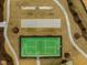 Aerial view of a community park with a tennis court and bocce ball court, walking trails, and freshly mowed landscaping at 1033 Channel Drop Lp, Zebulon, NC 27597