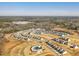 A high angle shot shows the layout of the community and surrounding landscape at 1033 Channel Drop Lp, Zebulon, NC 27597