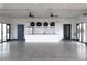 Spacious kitchen with modern white cabinets, stainless steel appliances, and pendant lighting at 1033 Channel Drop Lp, Zebulon, NC 27597