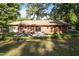 Backyard patio with seating, sliding doors, and landscaped garden, perfect for relaxation at 108 Jefferson Dr, Durham, NC 27712
