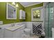 Updated bathroom featuring a modern sink, vanity, and wainscoting at 108 Jefferson Dr, Durham, NC 27712
