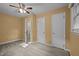 Bedroom with two closets, two windows, and access to an en suite bathroom at 108 Jefferson Dr, Durham, NC 27712