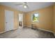 Bedroom with two windows, ceiling fan, and access to the en suite bathroom at 108 Jefferson Dr, Durham, NC 27712