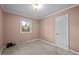 Cozy carpeted bedroom with a window and closet at 108 Jefferson Dr, Durham, NC 27712