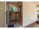 Covered front porch with a secure entry door, offering a welcoming entrance to the home at 108 Jefferson Dr, Durham, NC 27712