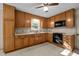 Traditional kitchen with wooden cabinets, white countertops and black appliances at 108 Jefferson Dr, Durham, NC 27712