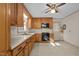 Bright kitchen features wood cabinetry, modern appliances, and a ceiling fan at 108 Jefferson Dr, Durham, NC 27712