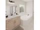 Bright bathroom with a soaking tub, double vanity, and modern fixtures at 109 Moonflower Ln # Homesite 260, Wilson's Mills, NC 27520