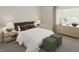 Cozy bedroom with a comfortable bed, bedside tables, lamps, and natural light at 109 Moonflower Ln # Homesite 260, Wilson's Mills, NC 27520