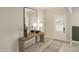Bright entryway featuring a mirror, table, and neutral decor at 109 Moonflower Ln # Homesite 260, Wilson's Mills, NC 27520