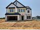 New construction home with a two-car garage and a black and white color scheme at 109 Moonflower Ln # Homesite 260, Wilson's Mills, NC 27520