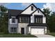 Charming two-story home with stone accents, white siding, and a neatly manicured lawn at 109 Moonflower Ln # Homesite 260, Wilson's Mills, NC 27520