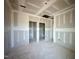 Unfinished hallway featuring framed doorway and spacious design awaiting personalized finishing touches at 109 Moonflower Ln # Homesite 260, Wilson's Mills, NC 27520