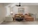 Comfortable living room featuring a sectional sofa, ceiling fan, and natural light at 109 Moonflower Ln # Homesite 260, Wilson's Mills, NC 27520
