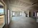 Unfinished living room featuring natural light, unfinished stairs, and open layout, ready for customization at 109 Moonflower Ln # Homesite 260, Wilson's Mills, NC 27520
