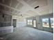 Unfinished living room boasting bright windows and a spacious design awaiting personalized finishing touches at 109 Moonflower Ln # Homesite 260, Wilson's Mills, NC 27520
