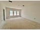 Unfinished living room featuring multiple windows letting in natural light at 109 Moonflower Ln # Homesite 260, Wilson's Mills, NC 27520
