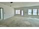 Unfinished living room featuring multiple windows and a door to the outside at 109 Moonflower Ln # Homesite 260, Wilson's Mills, NC 27520