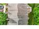 Aerial view of townhome roofs and treetops with green spaces and parking nearby at 1096 Kelso Ln # 18, Burlington, NC 27215