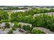 Overhead view of community with townhomes, trees, and parking spaces creating a vibrant and welcoming neighborhood at 1096 Kelso Ln # 18, Burlington, NC 27215