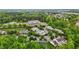 Aerial view shows homes among trees and landscaping, offering a community with a relaxed, natural setting at 1096 Kelso Ln # 18, Burlington, NC 27215
