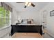 Bright bedroom boasts natural light, neutral walls, and a glimpse into an attached bathroom at 1096 Kelso Ln # 18, Burlington, NC 27215