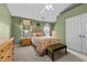 Nicely decorated bedroom with natural light, green walls, and carpeted flooring at 1096 Kelso Ln # 18, Burlington, NC 27215