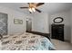 Bedroom with neutral tones, ceiling fan, and dark-toned furniture offers a serene setting at 1096 Kelso Ln # 18, Burlington, NC 27215