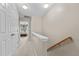 Hallway on the second floor showing access to bedroom and stairs at 1096 Kelso Ln # 18, Burlington, NC 27215