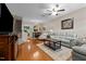 Spacious living room with hardwood floors, a ceiling fan, and an open view to the dining area at 1096 Kelso Ln # 18, Burlington, NC 27215
