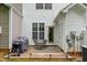 Cozy outdoor patio with a grill, seating, and privacy, perfect for relaxing or entertaining at 1096 Kelso Ln # 18, Burlington, NC 27215