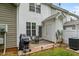 Cozy outdoor patio with a grill, seating, and privacy, perfect for relaxing or entertaining at 1096 Kelso Ln # 18, Burlington, NC 27215