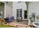 Cozy outdoor patio with a grill, seating, and privacy, perfect for relaxing or entertaining at 1096 Kelso Ln # 18, Burlington, NC 27215