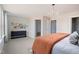 Cozy main bedroom with natural light, a walk-in closet, and a modern chandelier at 12 Hyacinth Ln # 102, Angier, NC 27501