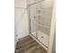 Modern bathroom featuring a glass-enclosed shower with tile surround at 12 Lavender Ln, Clayton, NC 27520
