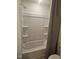 Bathroom shower featuring a shower head, handle and three shelves at 12 Lavender Ln, Clayton, NC 27520