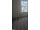 The bedroom has carpet flooring and a large window showing the outside at 12 Lavender Ln, Clayton, NC 27520