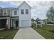Charming two-story townhome with a one-car garage and well-manicured front lawn at 12 Lavender Ln, Clayton, NC 27520