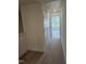 Hallway area leading into another room with a carpet flooring and white walls at 12 Lavender Ln, Clayton, NC 27520